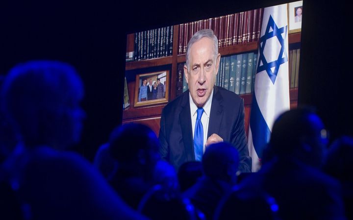 Israeli Prime Minister Benjamin Netanyahu speaks via a satellite television feed during the American Israel Public Affairs Committee (AIPAC) 2016 Policy Conference, March 22, 2016.