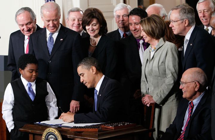 Former President Barack Obama signs the Affordable Health Care for America Act on March 23, 2010. The historic bill was passed by the House of Representatives after a 14-month political battle that left the legislation without a single Republican vote.