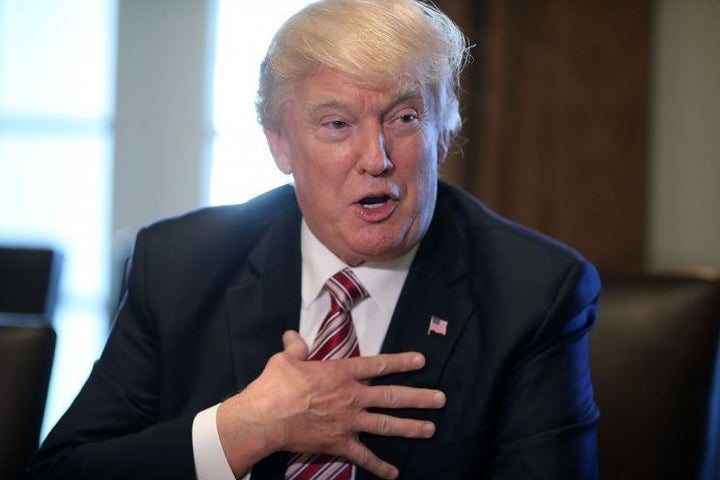President Trump is photographed during an interview with <em>Time </em>magazine’s Michael Scherer just prior to telling Scher