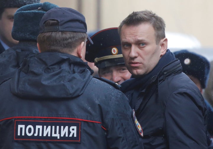 Russian opposition leader Alexei Navalny is escorted upon his arrival for a hearing after being detained at the protest against corruption and demanding the resignation of Prime Minister Dmitry Medvedev, at the Tverskoi court in Moscow, Russia March 27, 2017. (REUTERS/Maxim Shemetov)