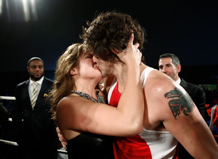 Trudeau (R) kisses his wife Sophie Gregoire after defeating conservative Senator Patrick Brazeau during their charity boxing match in Ottawa March 31, 2012.