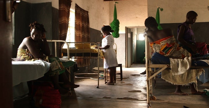 <p><em>A nurse-midwife and patients at Kasinje Health Facility, Malawi.</em></p>