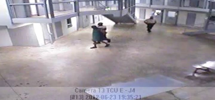 In surveillance video the night inmate Darren Rainey died, Rainey is seen being escorted from his cell to the shower by a guard.
