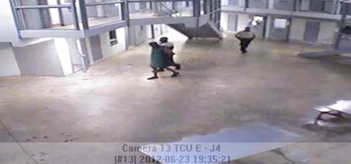 In surveillance video the night inmate Darren Rainey died, Rainey is seen being escorted from his cell to the shower by a guard.