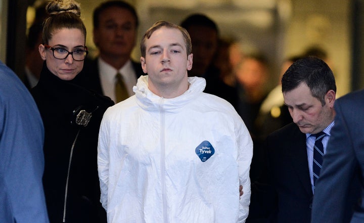 New York Police Department detectives escort James Jackson from the Manhattan South Precinct on March 22.