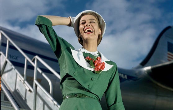 A model poses walking off the Pan American Clipper "Challenge" Lockheed 1049 airliner circa 1947.