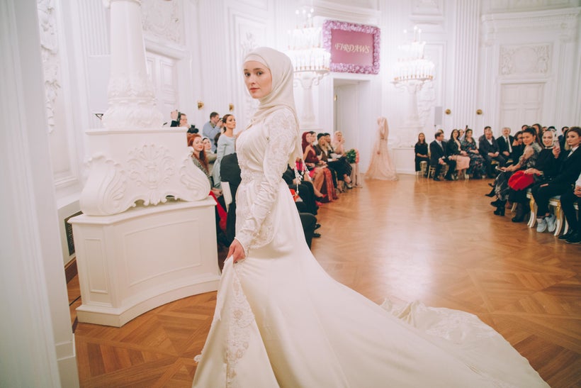 Models present gowns during Firdaws runway show led by Aishat Kadyrova at Mercedes-Benz Fashion Week Russia