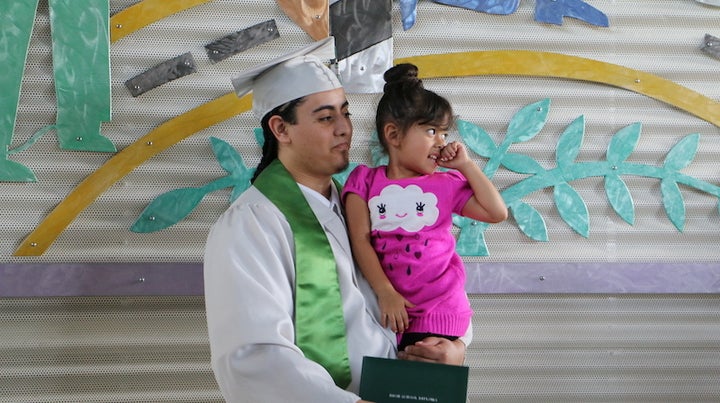 Daniel with his daughter Mila at his graduation at Green Hill School Juvenile Detention Center.