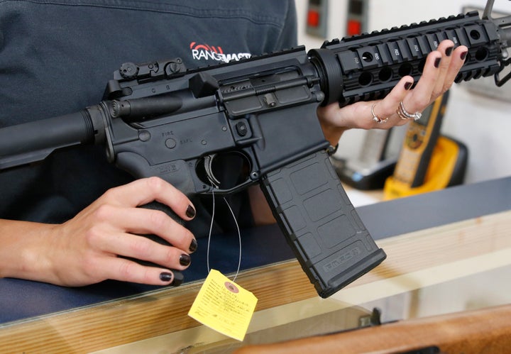 Authorities said the 23-year-old man used an AR-15 semiautomatic gun, similar to the one pictured, to kill the three suspects.