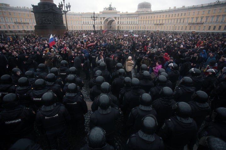 Russian riot police face protesters demonstrating against Russian Prime Minister Dmitry Medvedev in St. Petersburg, Russia, on March 26, 2017.