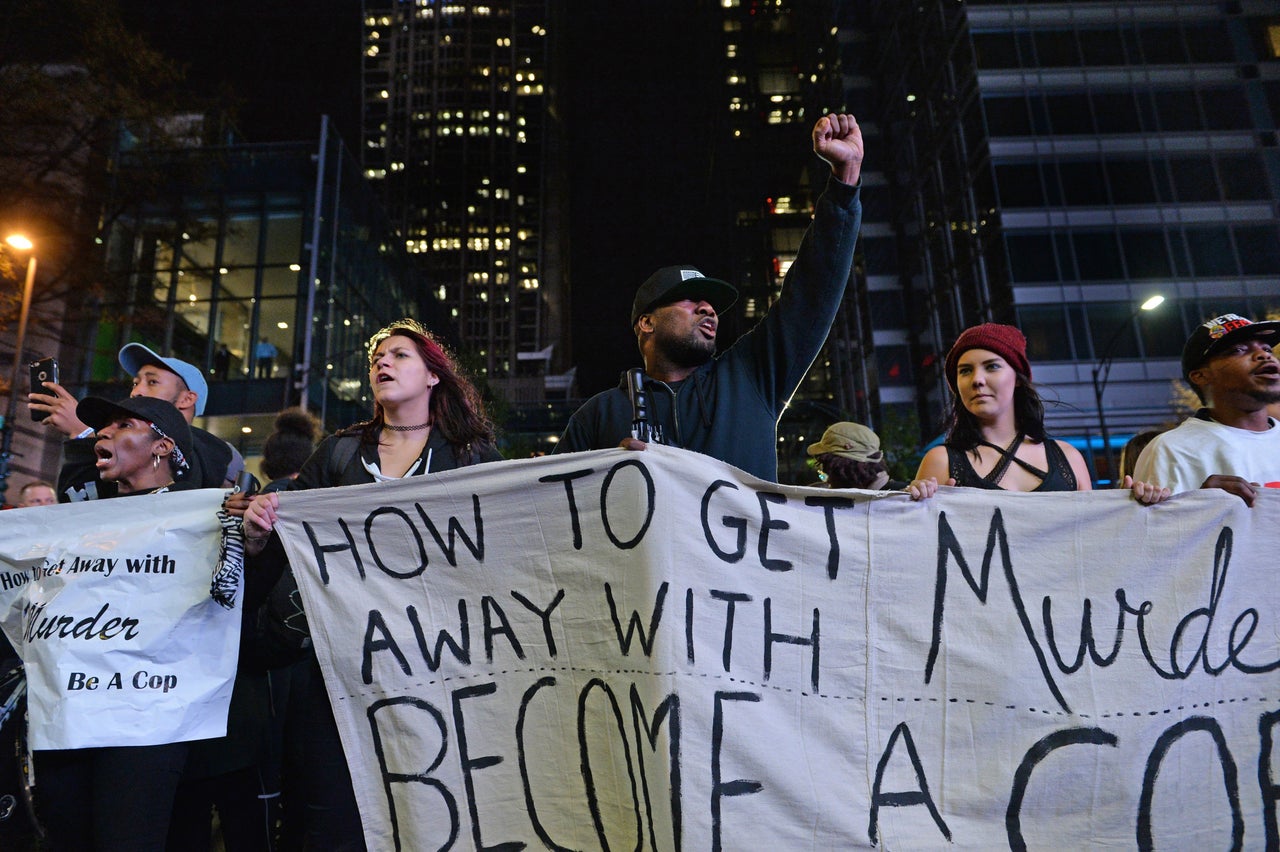 Protesters march through various neighborhoods in Charlotte, North Carolina, on Nov. 30, 2016, following the exoneration of the police officer who shot and killed Keith Scott, 43.