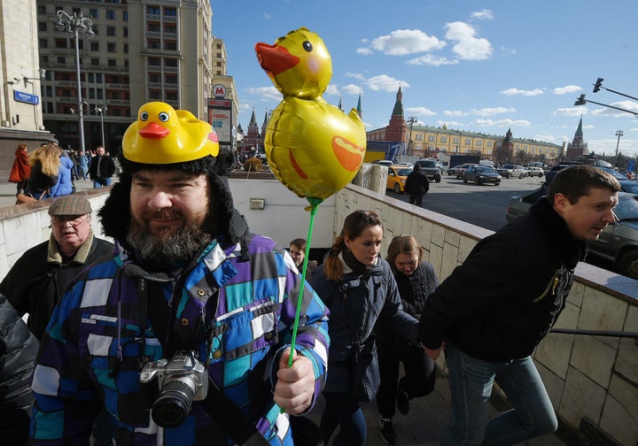 A protester holds a yellow duck toy during anti-corruption demonstrations on March 26, 2017 in Moscow. 