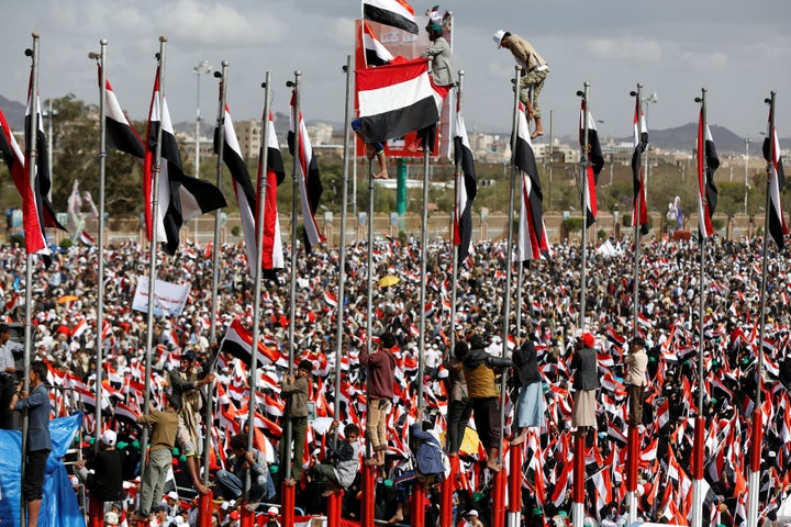 Supporters of the Houthi movement and Yemen's former president Ali Abdullah Saleh attend a rally to mark two years of the mil