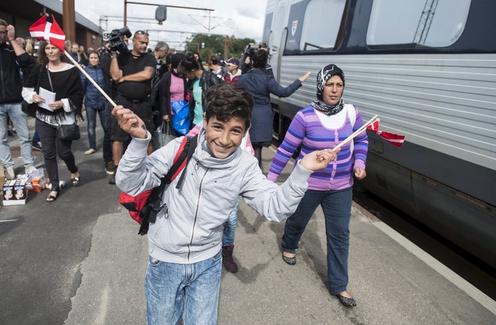 Migrants board a train to Sweden from Denmark on in September 2015.