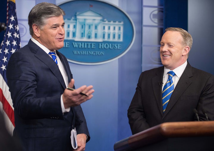 Fox News host Sean Hannity appears in the White House briefing room with Trump press secretary Sean Spicer. 