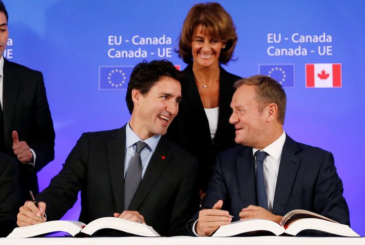Canada's Prime Minister Justin Trudeau and European Council President Donald Tusk attend the signing ceremony of the Comprehensive Economic and Trade Agreement (CETA), at the European Council in Brussels in October 2016.