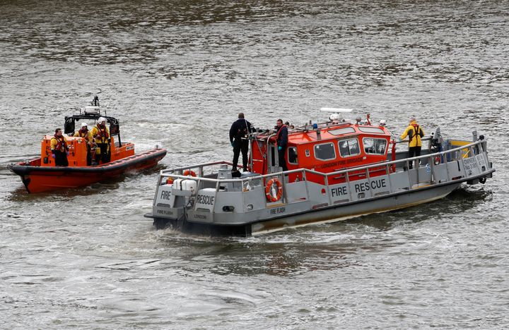 Emergency services patrol after a man fell off Westminster Bridge into the Thames.