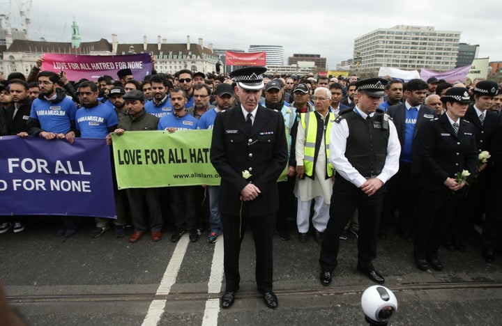 Superintendent Jon Williams (centre) joins a vigil held on Westminster Bridge in London, exactly a week since the Westminster terror attack took place.