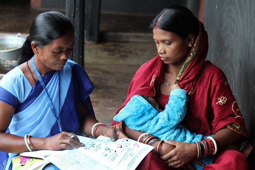 <em>An accredited Social Health Activist in northeastern India discusses the importance of exclusive breastfeeding in the fir