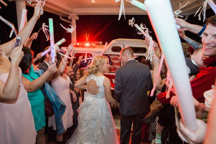 The bride and groom left their reception in a fire engine.