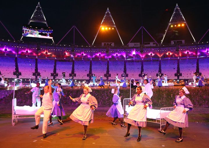 Nurses representing the NHS take part in the Opening Ceremony of the London 2012 Olympic Games.