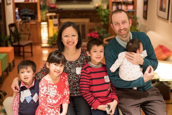 Kathy Tran poses with her husband and four children. Her daughter was born around the time of Donald Trump's inauguration, inspiring her run for office.