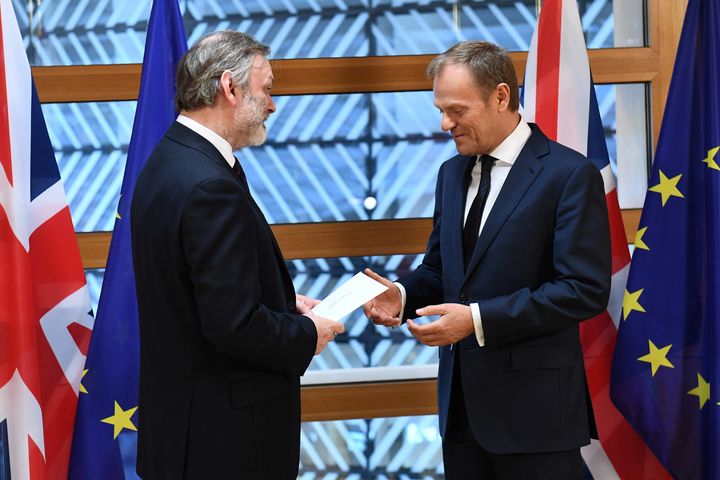 Britain's permanent representative to the European Union Tim Barrow is pictured delivering the Brexit letter to EU Council President Donald Tusk on Wednesday
