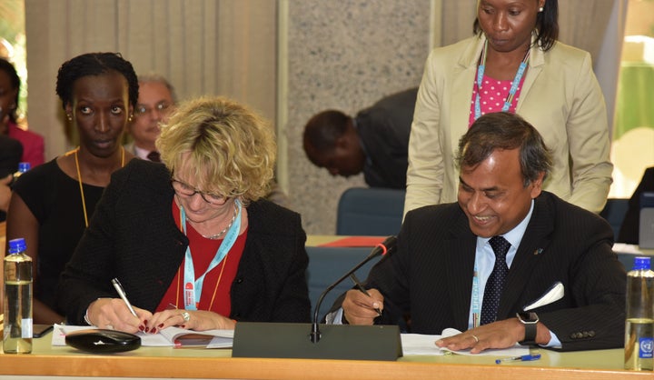 The Ambassador of Denmark to Kenya, H.E. Mette Knudsen and the UN Resident Coordinator, Siddharth Chatterjee signing the agreement. 