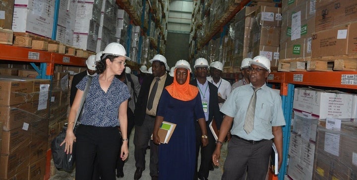 PATH project staff and partners take a guided tour of a national medical storage facility.