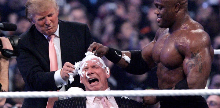 Donald Trump and WWE wrestler Bobby Lashley shave the head of CEO Vince McMahon during Wrestlemania 23 in 2007.