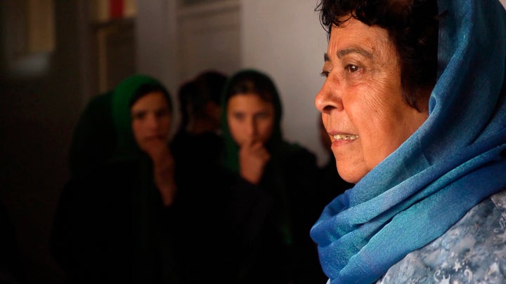 Razia Jan greets students at the Zabuli Education Center, a K-12 girls’ school in Afghanistan. 