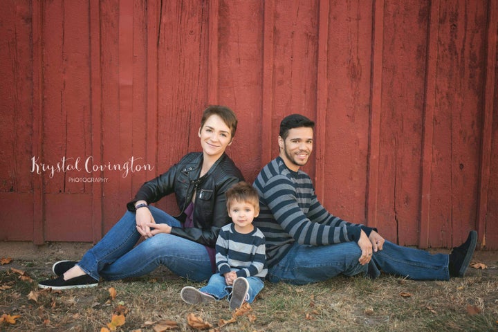 Victoria Baldwin, Adam Dyson and their son Bruce pose for a family portrait. 