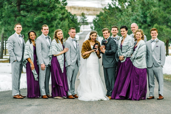 The wedding party posing with the fur babies.