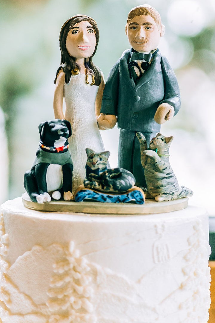 The cake topper featured the couple, their two cats and dog.