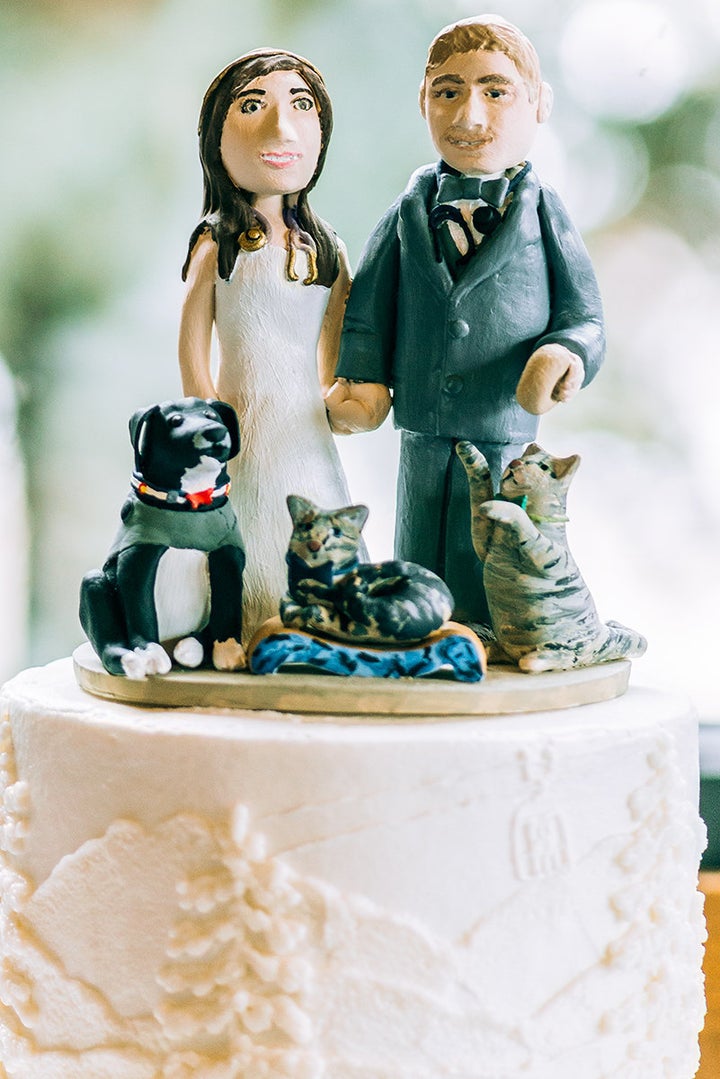 The cake topper featured the couple, their two cats and dog. 