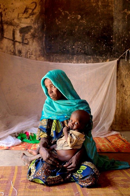 Izah fled to Monguno after a Boko Haram attack and is now a widow raising seven children alone.