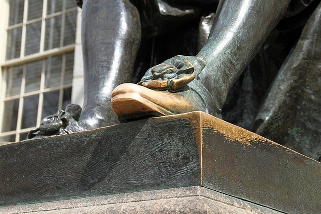 The foot of John Harvard.