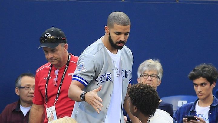Drake wearing a Toronto Blue Jays jersey.