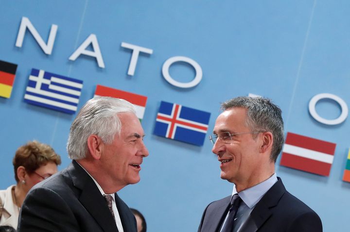 Secretary of State Rex Tillerson, left, shakes hands with NATO Secretary General Jens Stoltenberg during a NATO foreign ministers meeting at the Alliance's headquarters in Brussels.