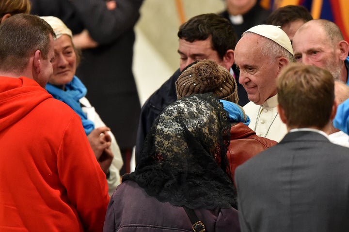 Pope Francis prays with homeless people on November 11, 2016 at the Vatican.