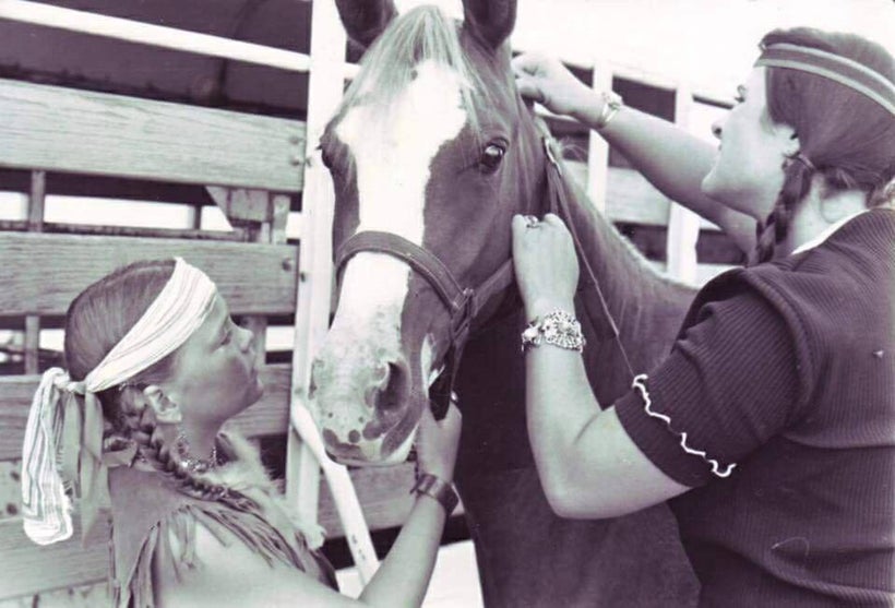 Overriding her death, there was a more humane and more living spirit to Lori Heimer. Photo of Lori, right, tending to a horse