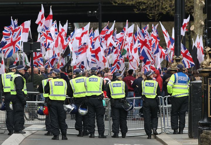 Police officers in front of Britain First and EDL protestors on Embankment