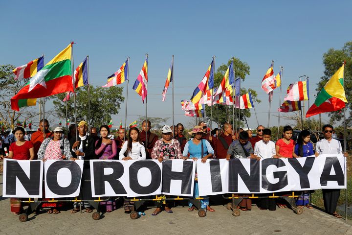 People and Buddhist monks protest while Malaysian NGO's aid ship carrying food and emergency supplies for Rohingya Muslims arrives at the port in Yangon, Myanmar February 9, 2017.