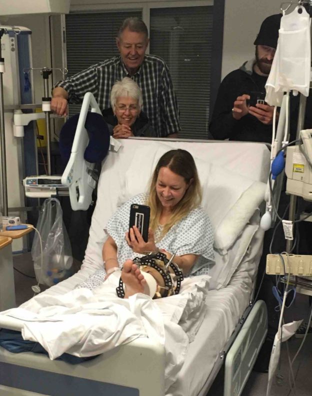 Cochran surrounded by friends and family in her hospital bed