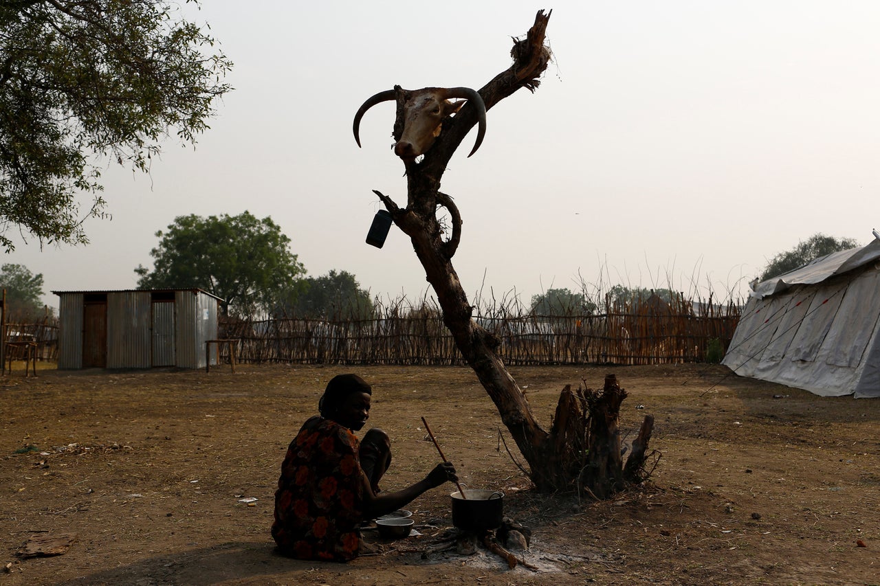 A woman cooks a meal in Pibor, a town in Boma state in South Sudan on Feb. 2.