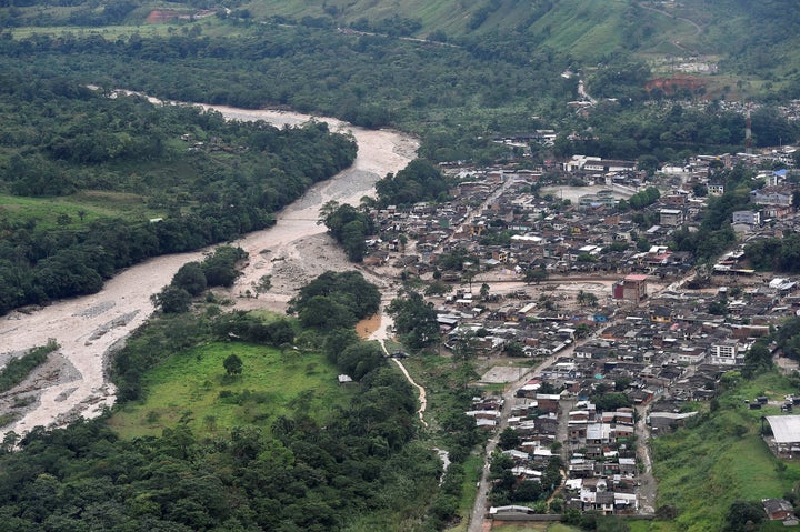 An aerial view shows a flooded area after heavy rains caused several rivers to overflow, pushing sediment and rocks into buil