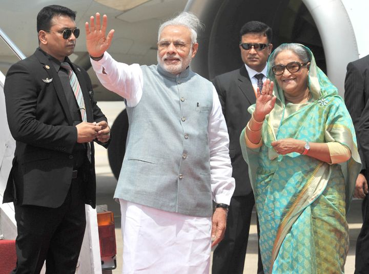 The Indian Prime Minister Narendra Modi being welcomed by the Prime Minister of Bangladesh, Ms. Sheikh Hasina on his arrival, in Hazrat Shahjalal Airport, Dhaka on June 06, 2015. 