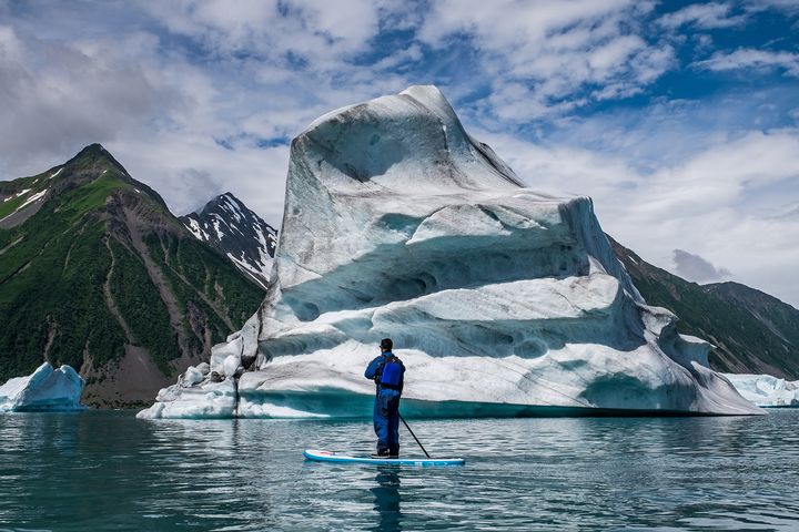 Stand up paddle with our new friends near Bear Glacier in Kenai Fjords National Park in Alaska. 