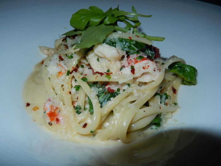 Cliff signature starter is lobster with linguine, rocket, chive sauce and chili pepper. 