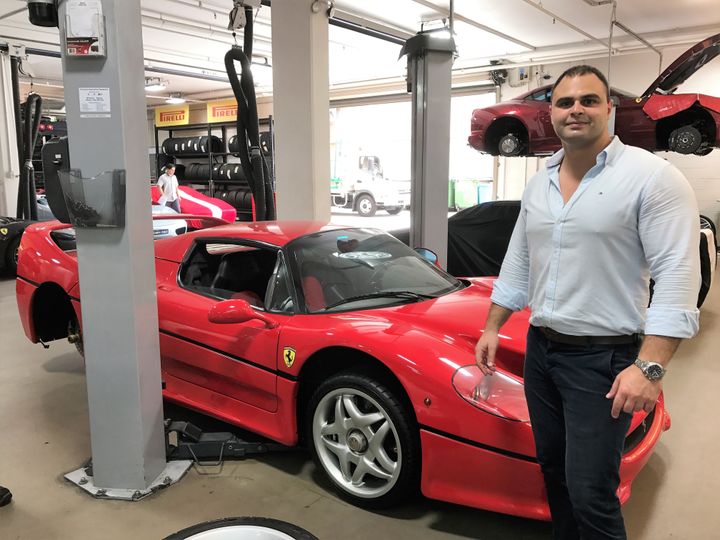 Lecha Khouri standing beside the 1995 Ferrari F50